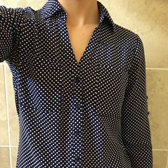 navy blue blouse with white polka dots